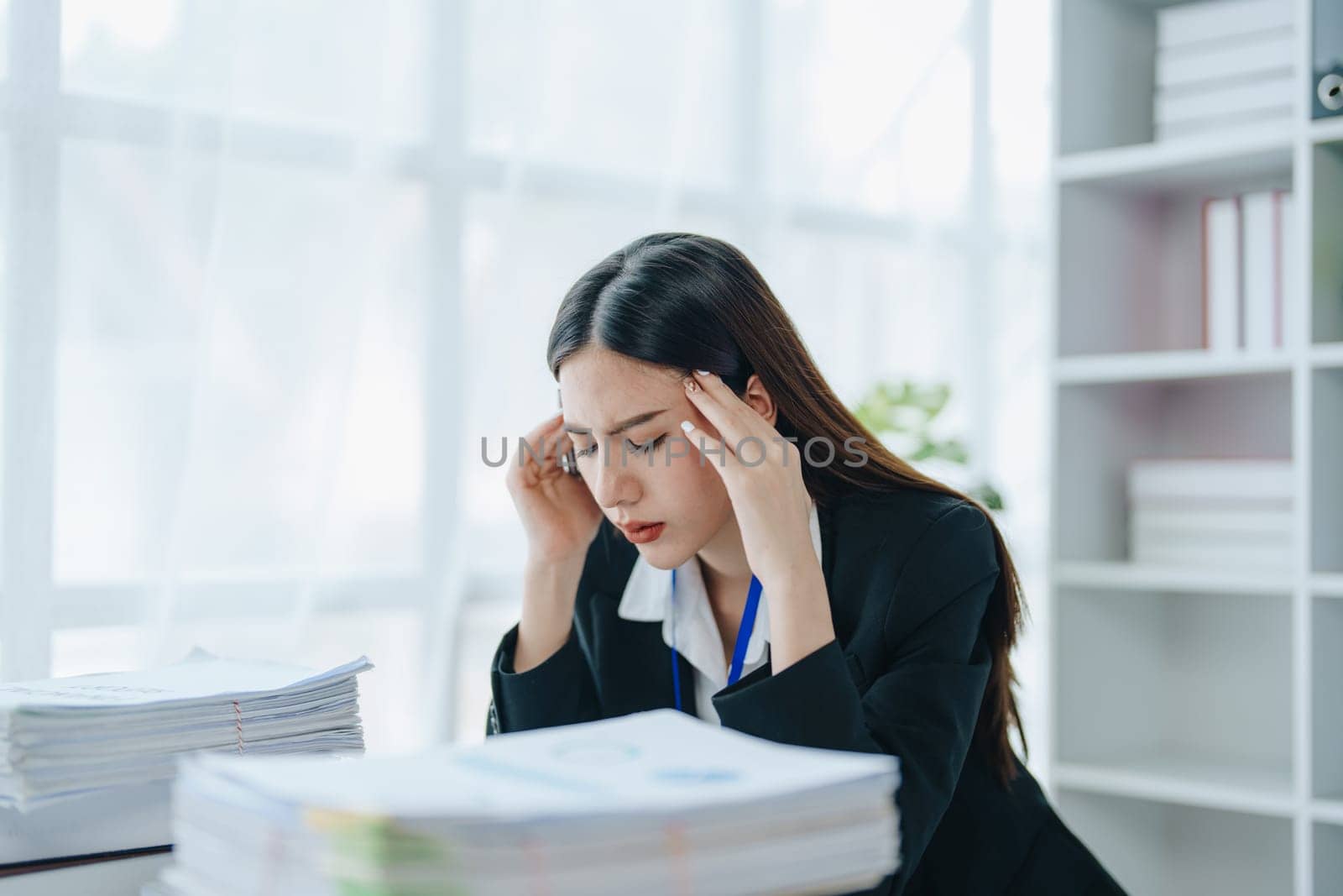 Portrait of business owner, woman using computer and financial statements Anxious expression on expanding the market to increase the ability to invest in business by Manastrong