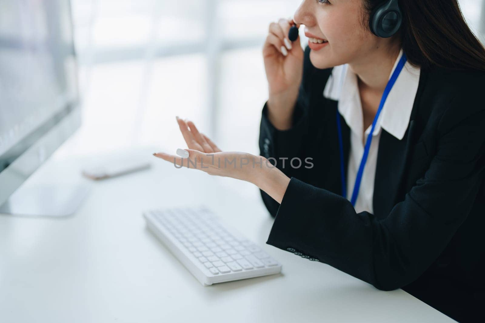 young business woman wear wireless headset video conference calling on laptop computer talk by webcam discussing in online meeting about budget and profit of company. copy space concepts.