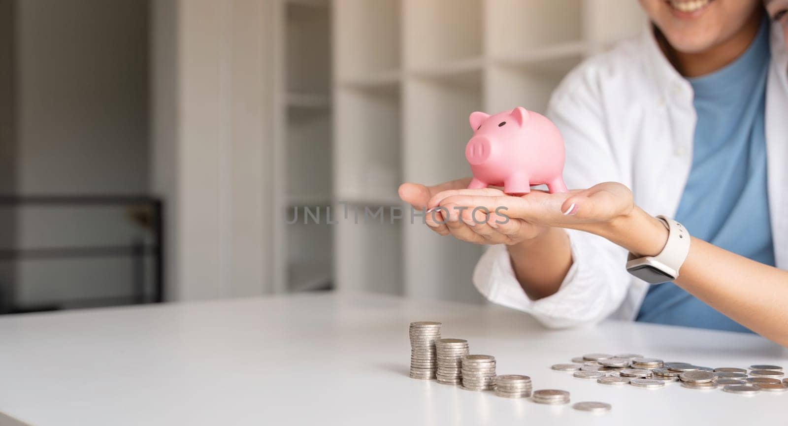 Saving money investment for future. Couple hands holding piggy bank with money . Couple asian counting saving money plan future budget. Investment banking concept by nateemee