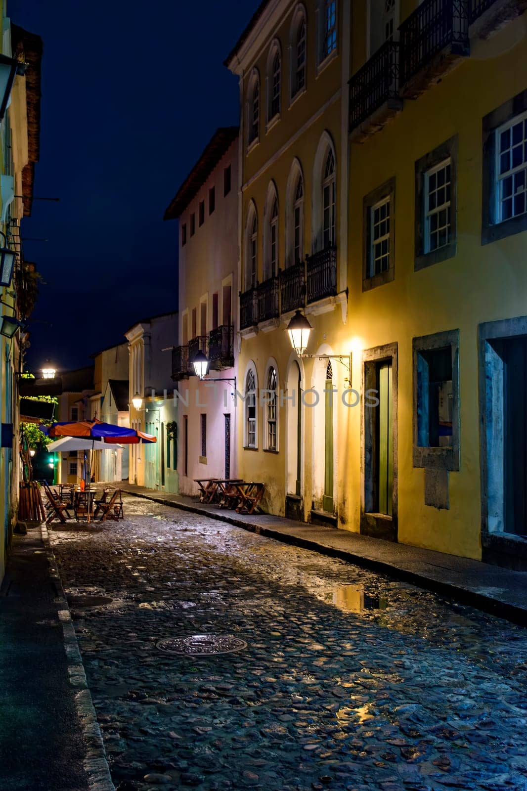 Pelourinho street in Salvador city at night with the facade of old houses illuminated by lanterns