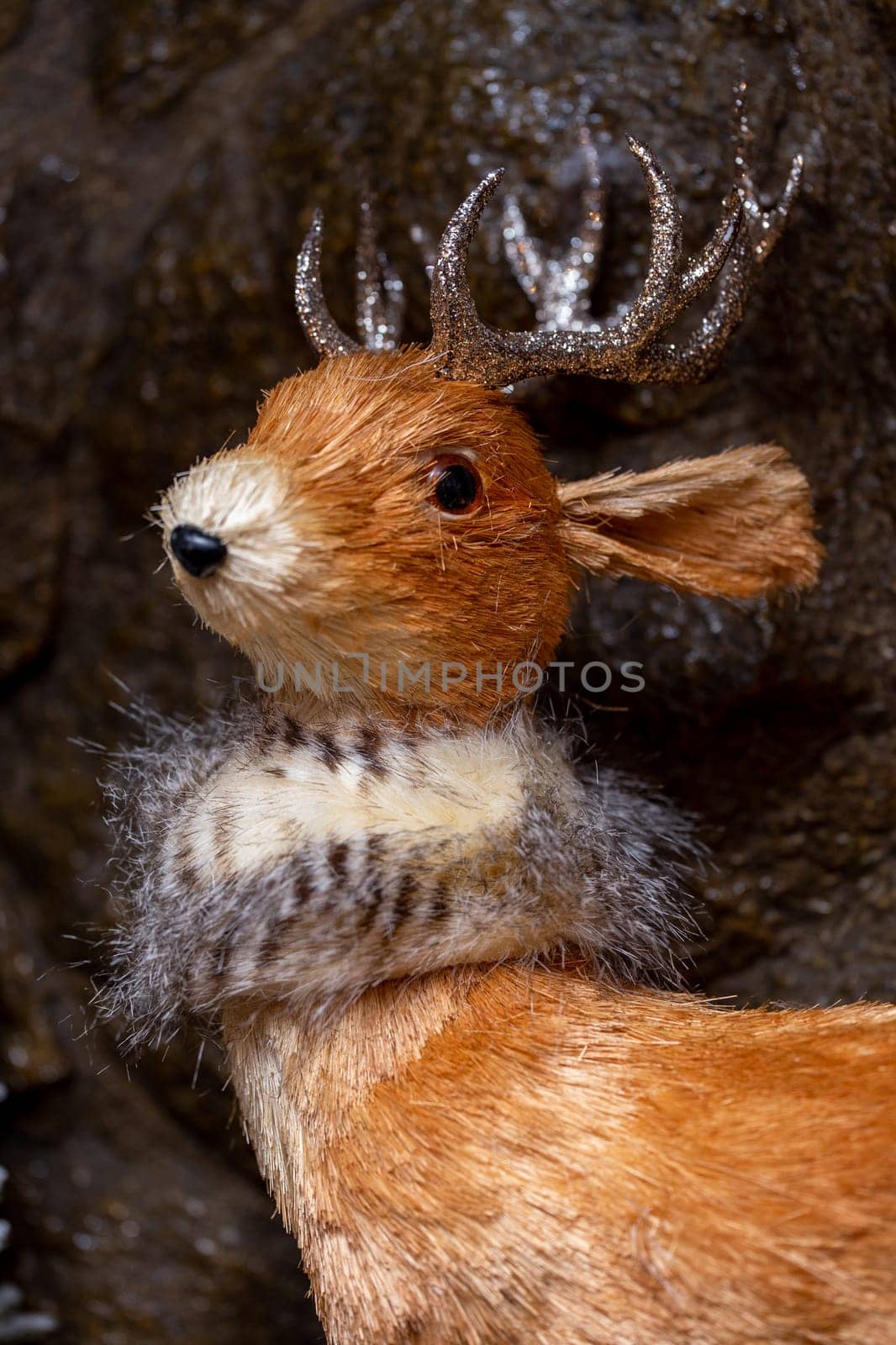 close-up of a deer's head on a gray background. fawn statue for new year decor.