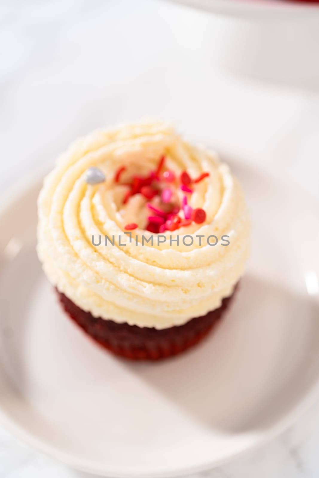 Red Velvet Cupcakes with White Chocolate Ganache Frosting by arinahabich