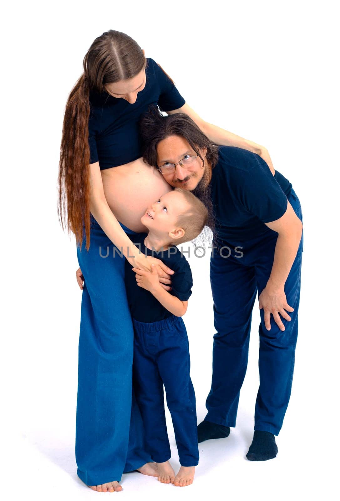 beautiful european happy family with a pregnant mother, the father and a son together. High quality photo