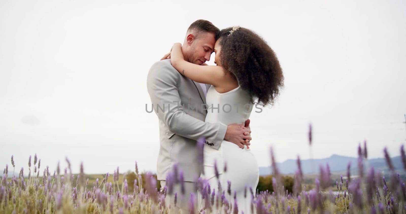 Outdoor, hug and couple with celebration, wedding and romance with marriage, happiness and countryside. Man, happy woman and embrace with commitment, love and bride with groom, summer and romantic by YuriArcurs