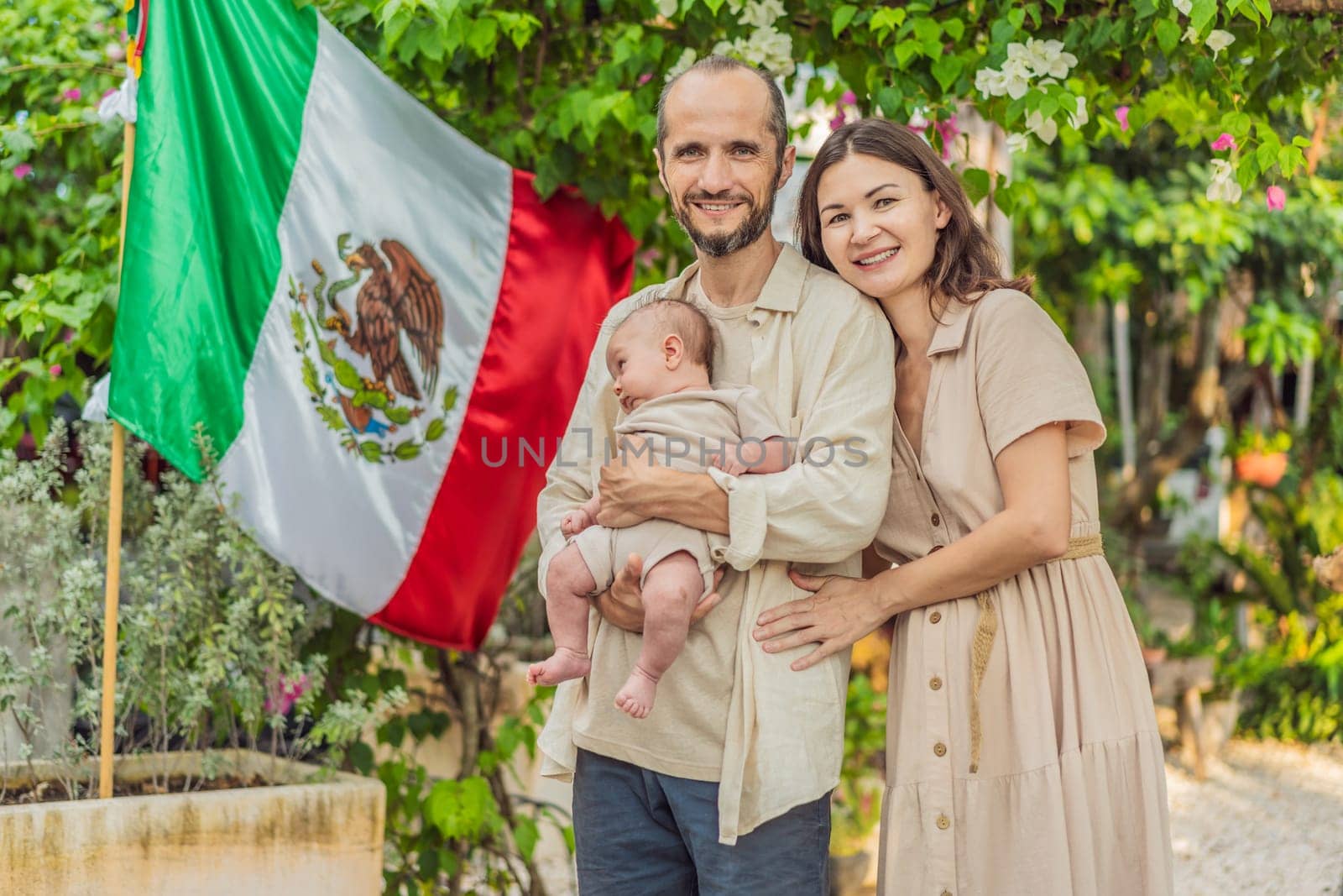 Immigrant family in front of the Mexican flag. New Mexicans. Childbirth in Mexico by galitskaya