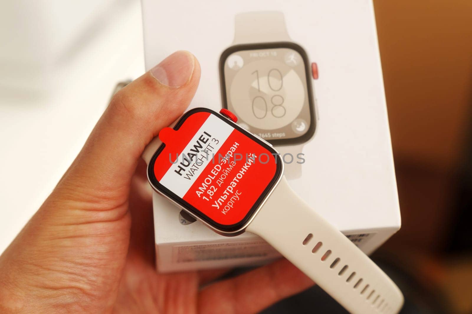 Tyumen, Russia-June 20, 2024: Huawei Watch Fit 3 with a red screen displaying the text AMOLED