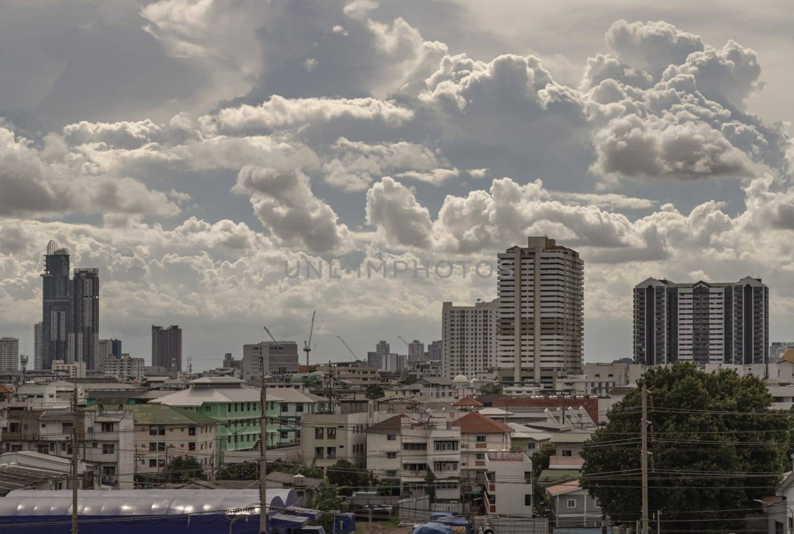 Bangkok, Thailand - 28 Aug 2024 - Amazing Clouds and Sky over Metropolitan City. Bangkok city skyscrapers at Afternoon with Dramatic sky background. use it as your wallpaper, poster and banner design, Selective focus.
