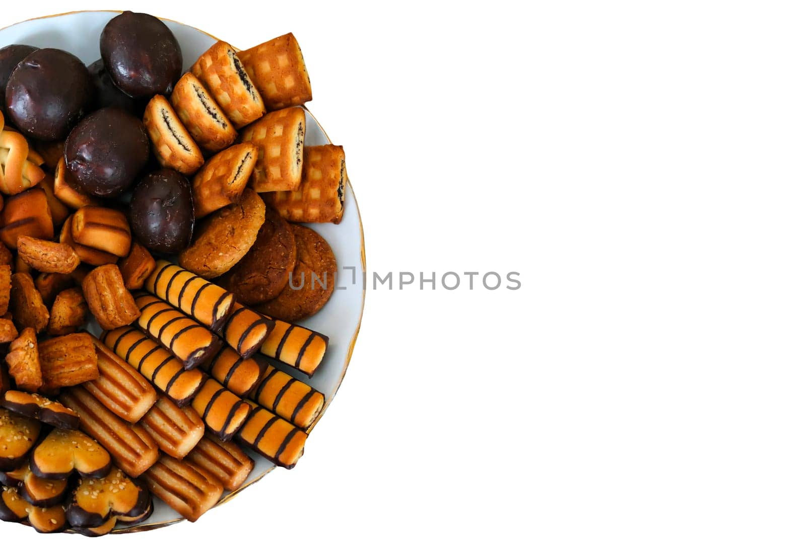 An inviting selection of various cookies and snacks is beautifully arranged on a plate, perfect for sharing during a cheerful afternoon gathering with friends or family.