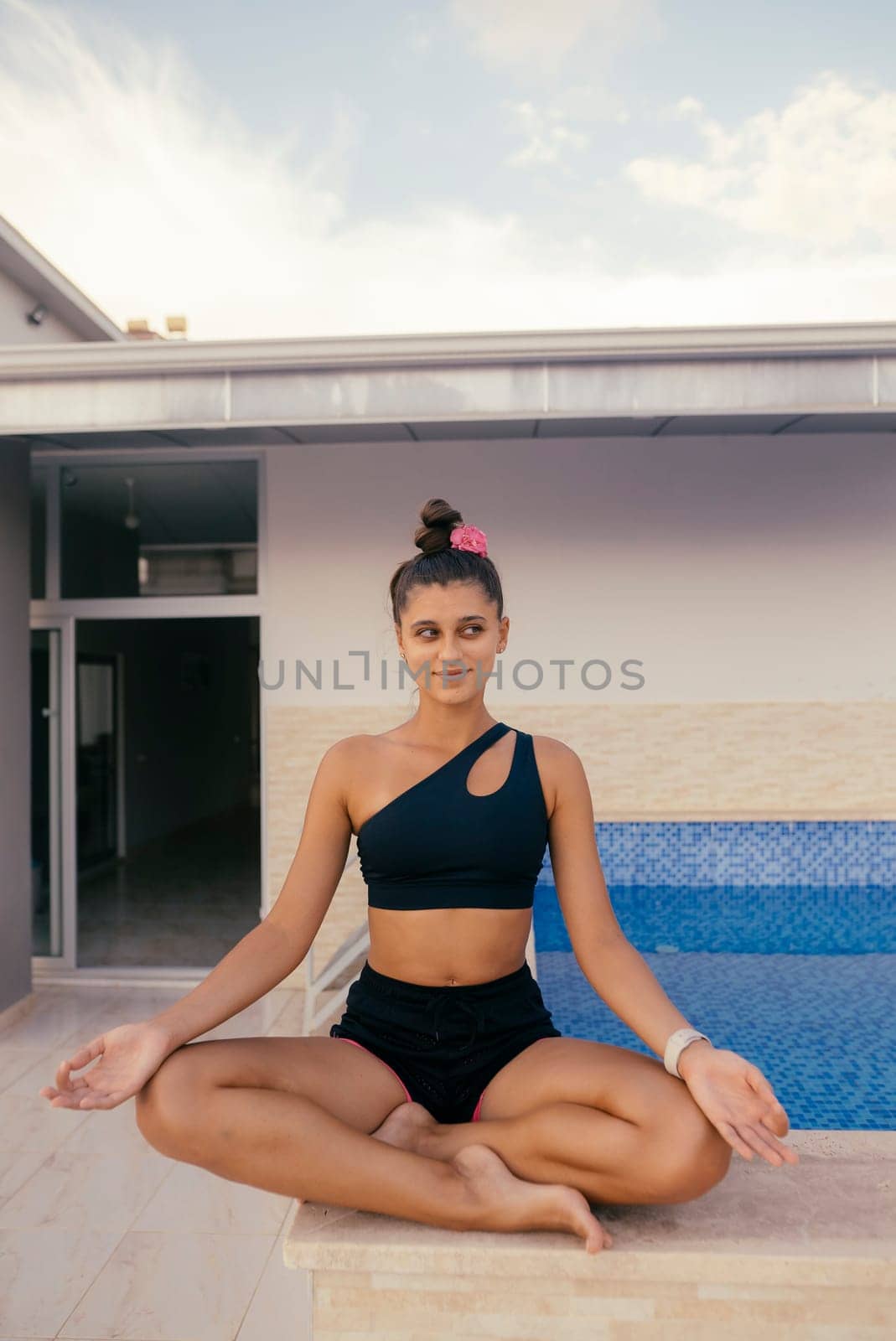 Experience the joy of mindfulness while lounging by the serene pool, showcasing a fit individual in stylish swimwear