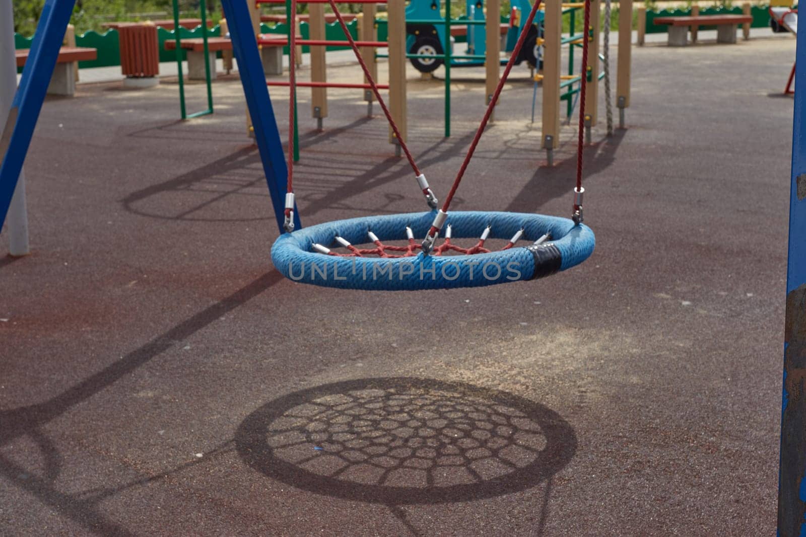 A playground on the street. Hanging swing for relaxing with children.