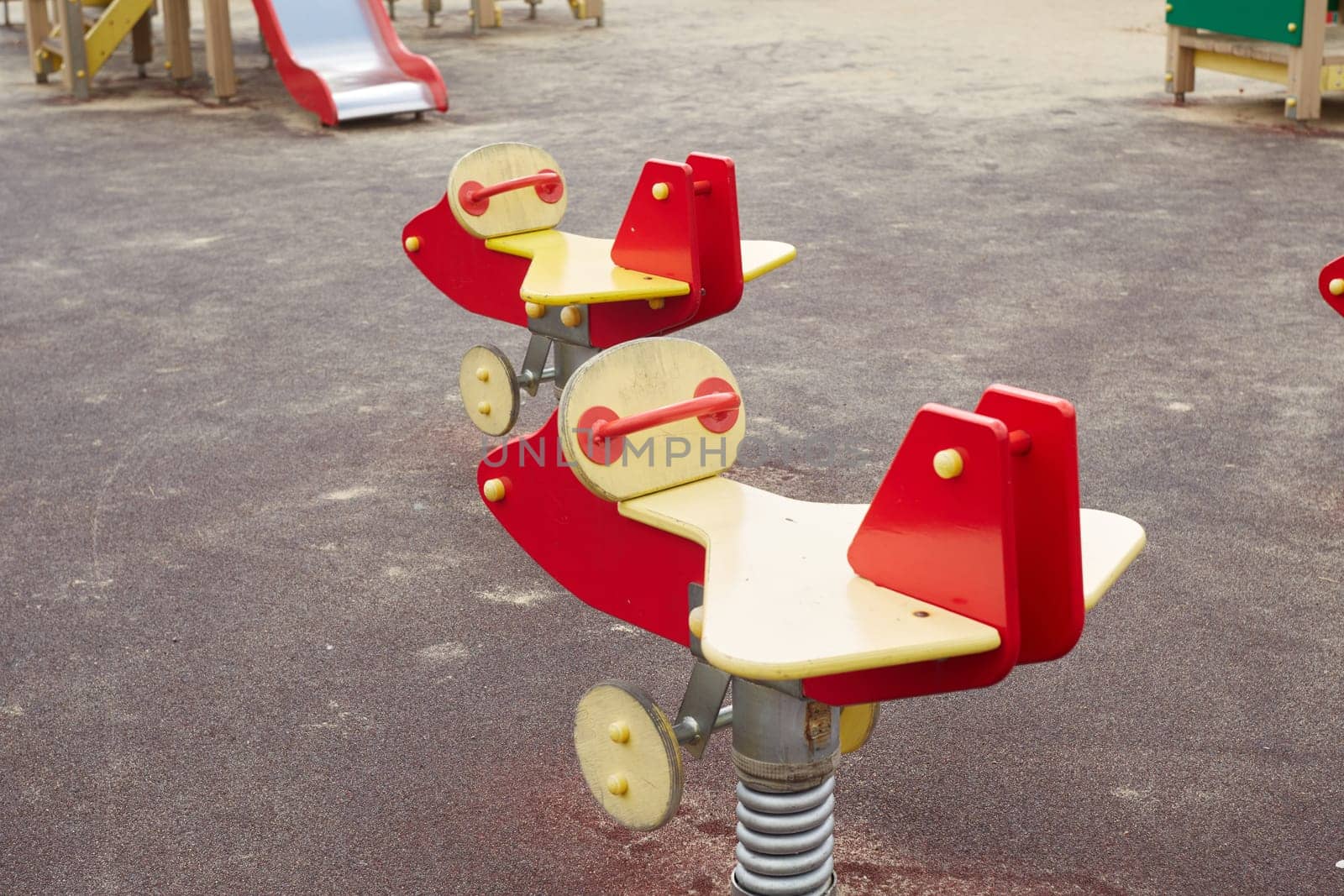 A playground on the street. Hanging swing for relaxing with children. Wooden Swing in the form of airplanes.