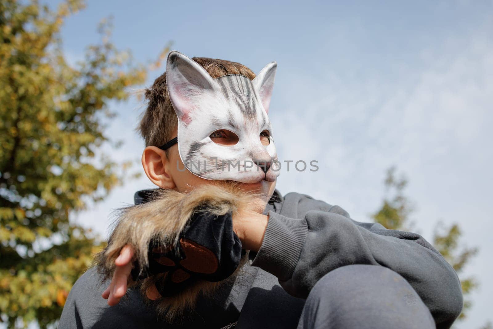 Teenager in a cat mask and gloves doing Quadrobics . aggressive Teenager in a Quadrobics mask jumps like a cat, Quadrobics - Sport