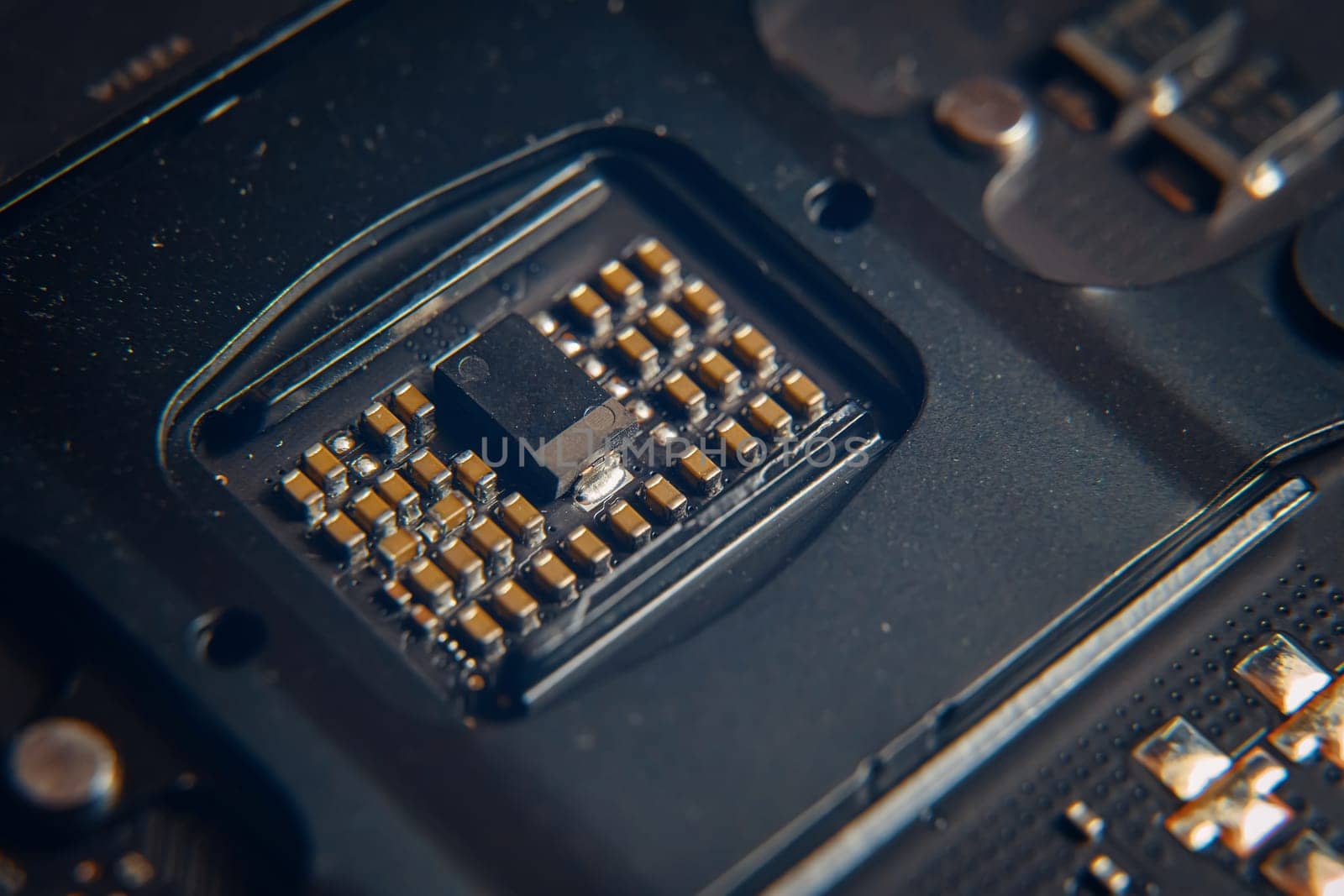 This is a detailed view of a microchip that is embedded onto a circuit board, showcasing precision engineering efforts