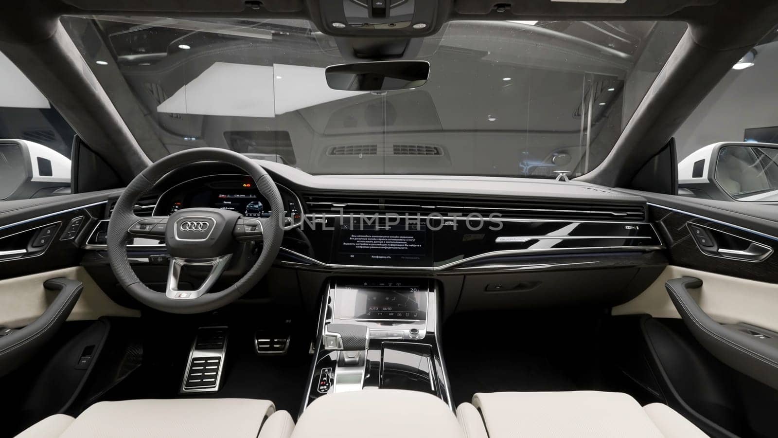Berlin, Germany - May 19, 2022: Audi new passenger car interior. Action. Salon of a german luxury car with a steering wheel and dashboard