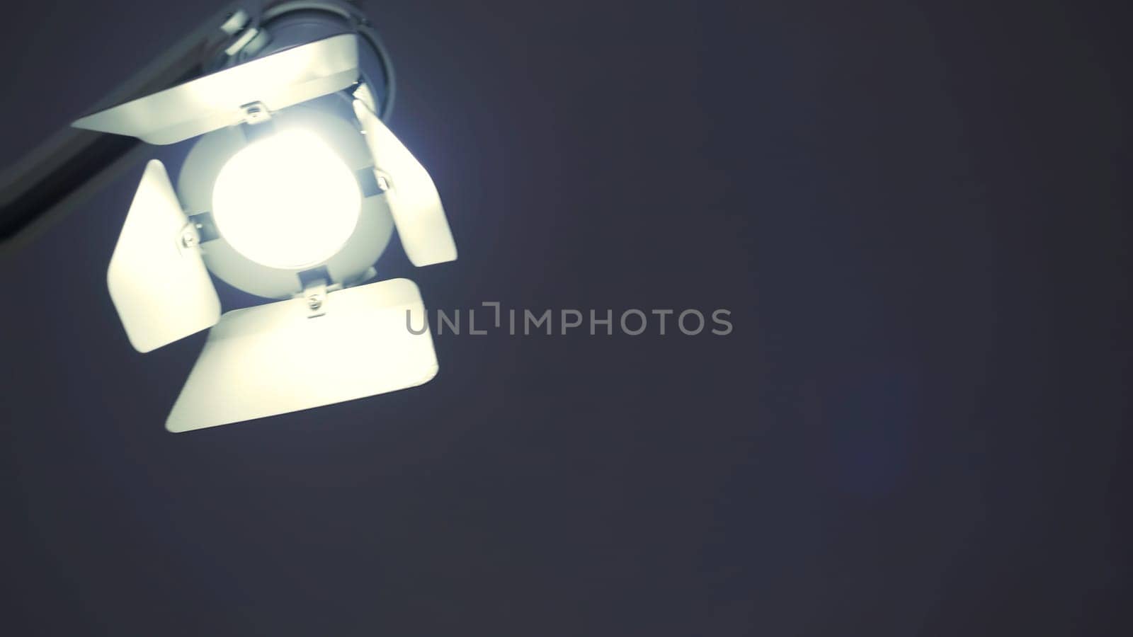 Close-up of spotlight in studio. HDR. Professional light spotlight for studio shooting. Small spotlight or lamp for photo shoot or studio shooting.