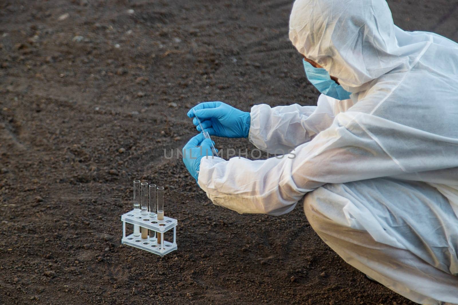 Soil analysis in a test tube. Selective focus. Nature.