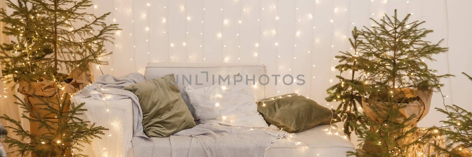 Interior bedrooms in Scandinavian style, decorated for the Christmas holidays. Live ate in the interior