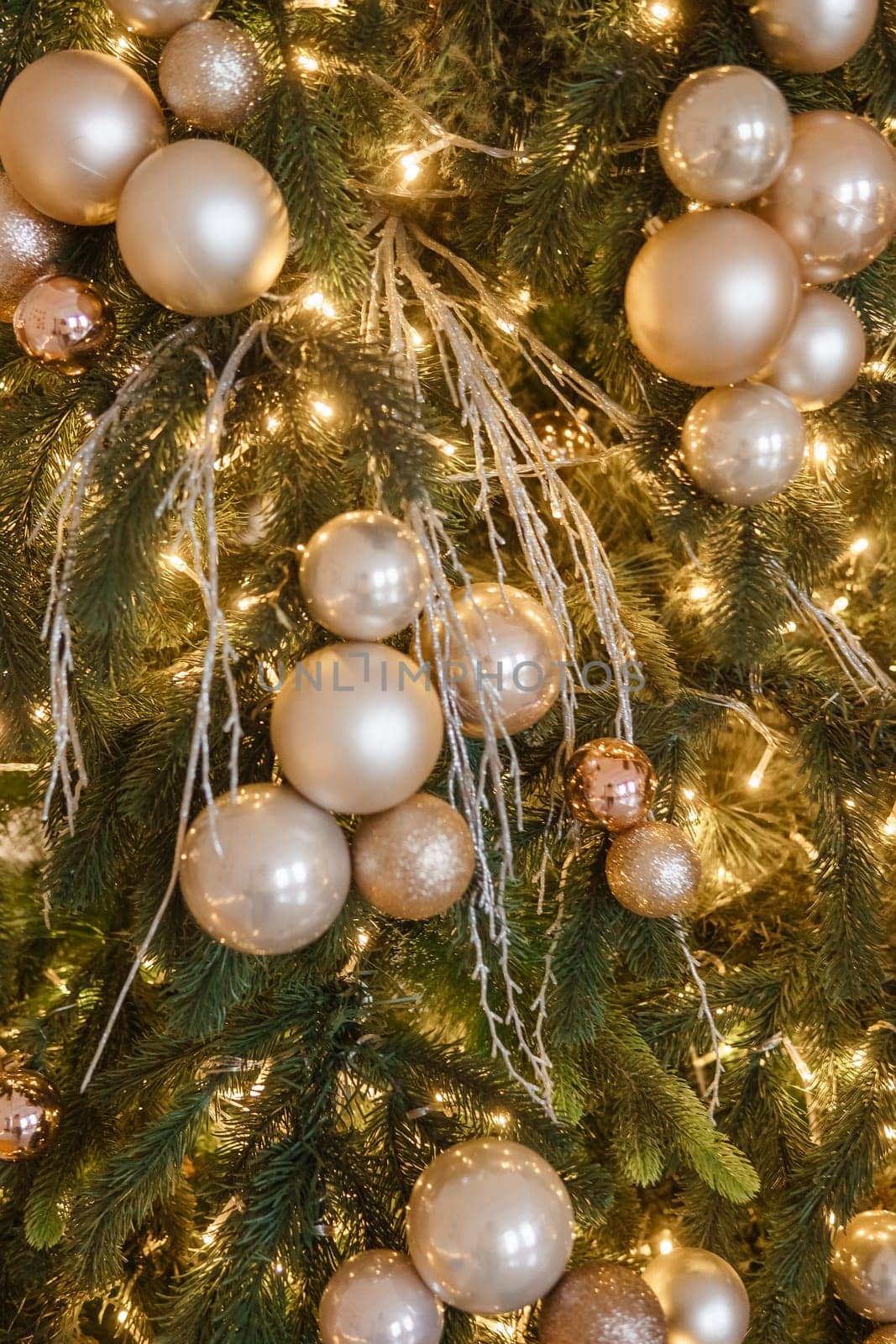 Christmas balls in close-up on the Christmas tree. Decorations for Christmas trees. The concept of celebrating New Year and Christmas