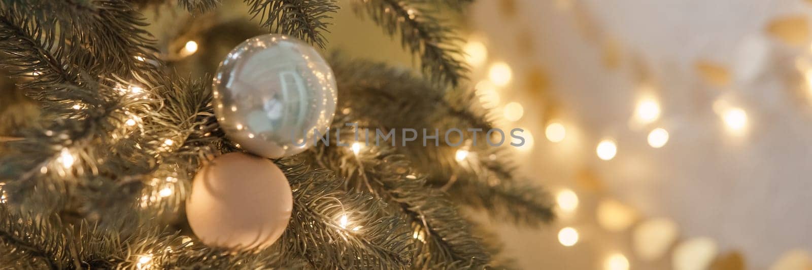Christmas balls in close-up on the Christmas tree. Decorations for Christmas trees. The concept of celebrating New Year and Christmas