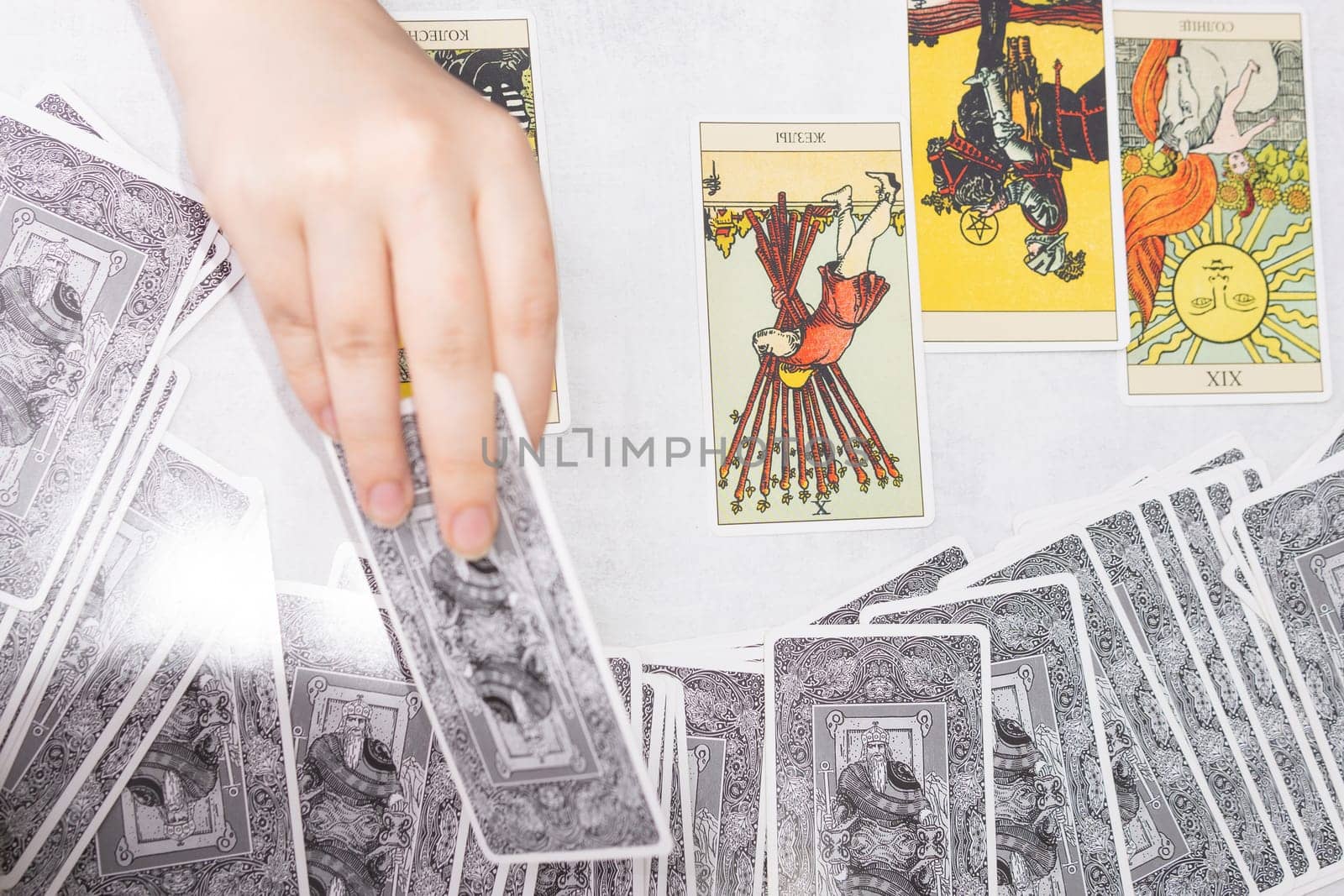 TVER, RUSSIA - FEBRUARY 18, 2024. Tarot cards, Tarot card divination, fortune telling. Occultism, esoteric education