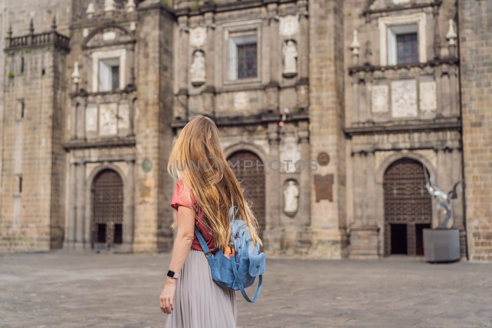 Female tourist in front of Catedral de Puebla, Mexico. Travel, cultural heritage, and historic architecture exploration concept.
