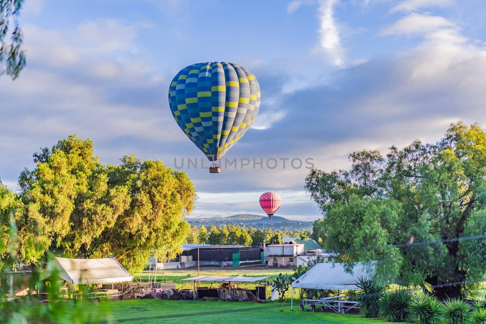 An aerial view of hot air balloons above the Teotihuacan pyramid. Adventure travel, cultural heritage, and aerial exploration concept.