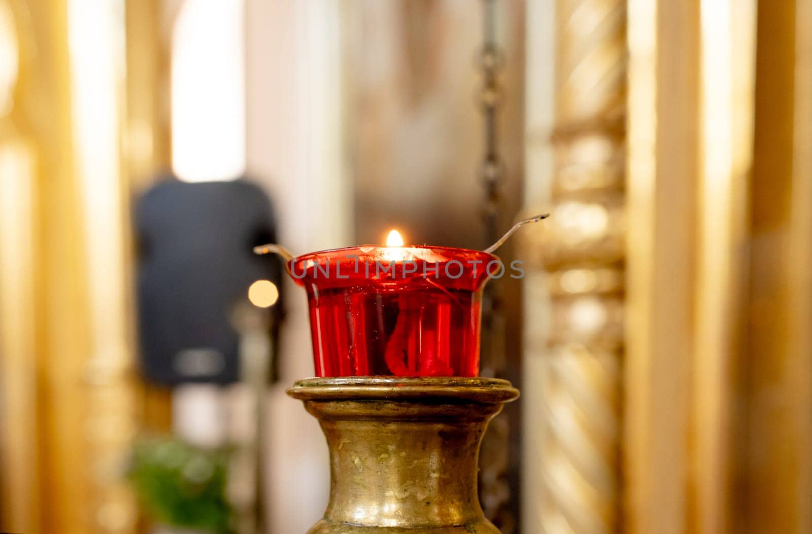Candle On Blurred Background Of Catholic Church Creates Serene Atmosphere