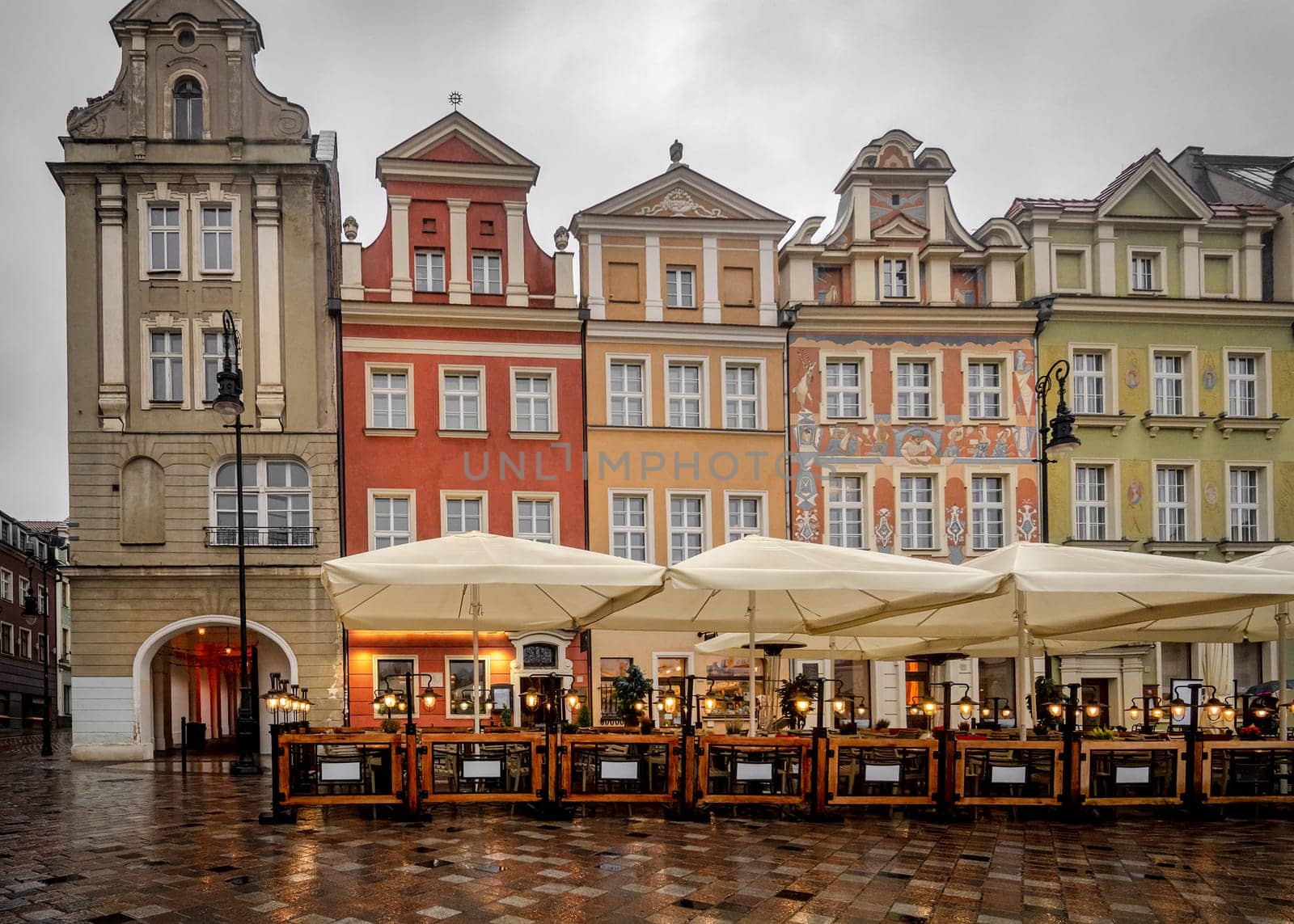 Street Cafe In Old Center Of Poznan Poses After Rain