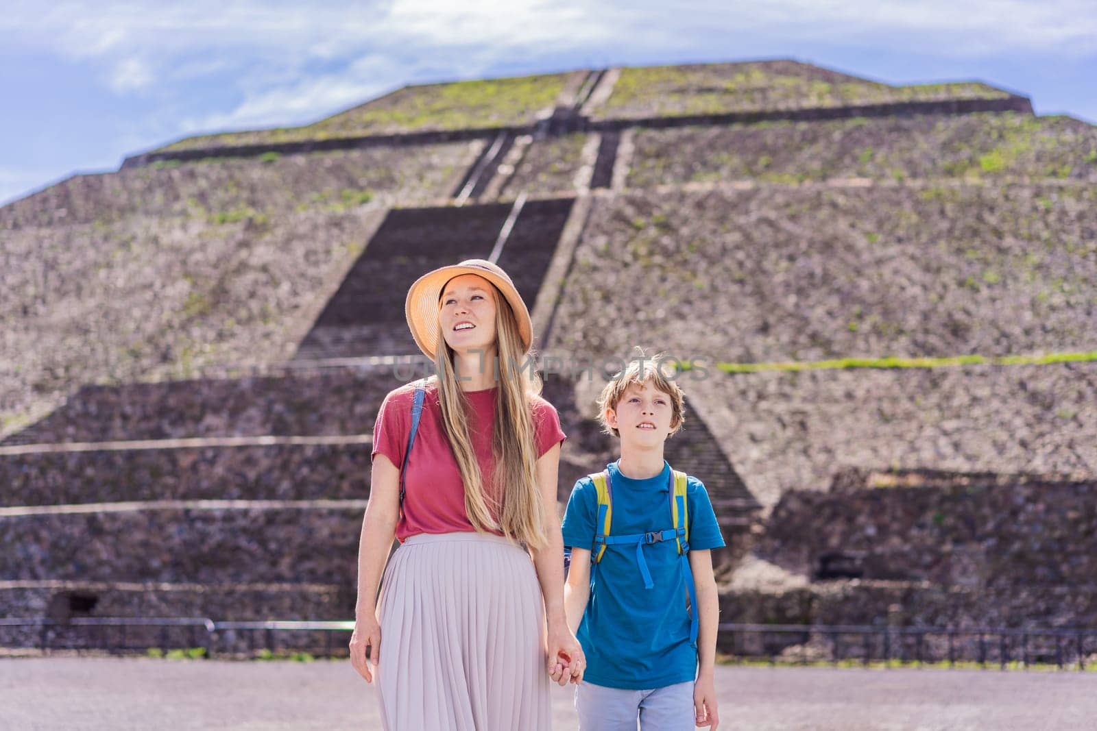 Mother and son tourists exploring Teotihuacan, Mexico. Cultural heritage, ancient ruins, and archaeological adventure concept.