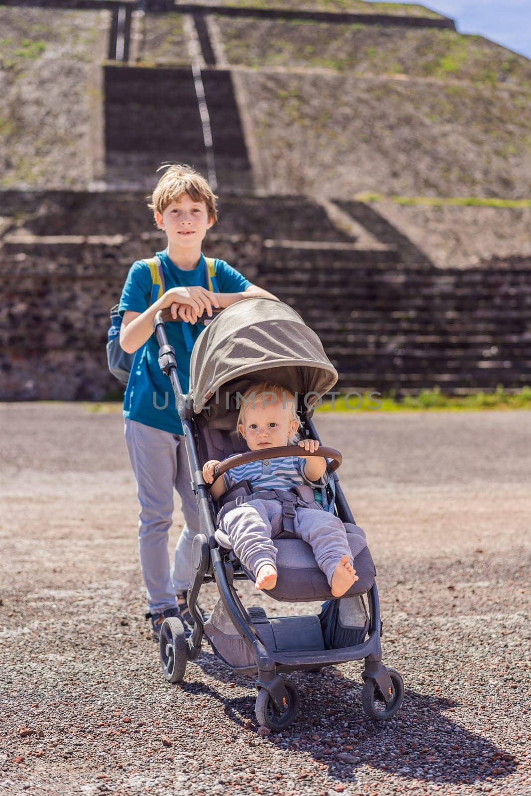 Toddler and teenage boys exploring Teotihuacan, Mexico. Cultural heritage, ancient ruins, and archaeological adventure concept