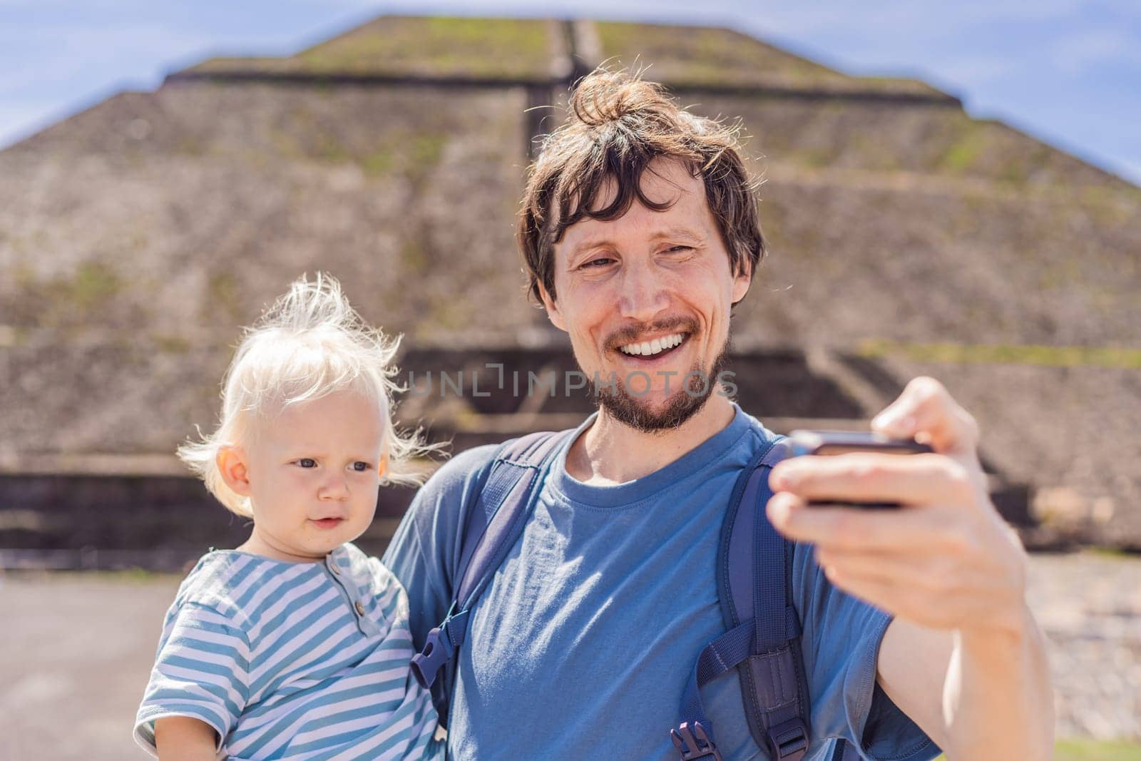 Father and son tourists exploring Teotihuacan, Mexico. Cultural heritage, ancient ruins, and archaeological adventure concept.