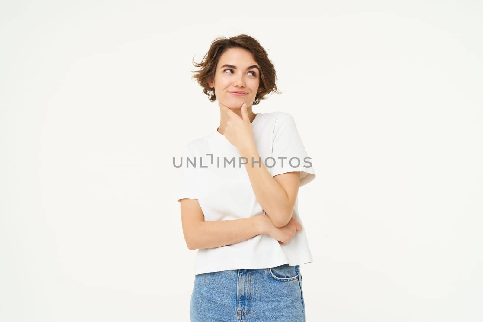 Portrait of thinking girl, smiling and pondering, making decision, contemplating something, standing over white background by Benzoix