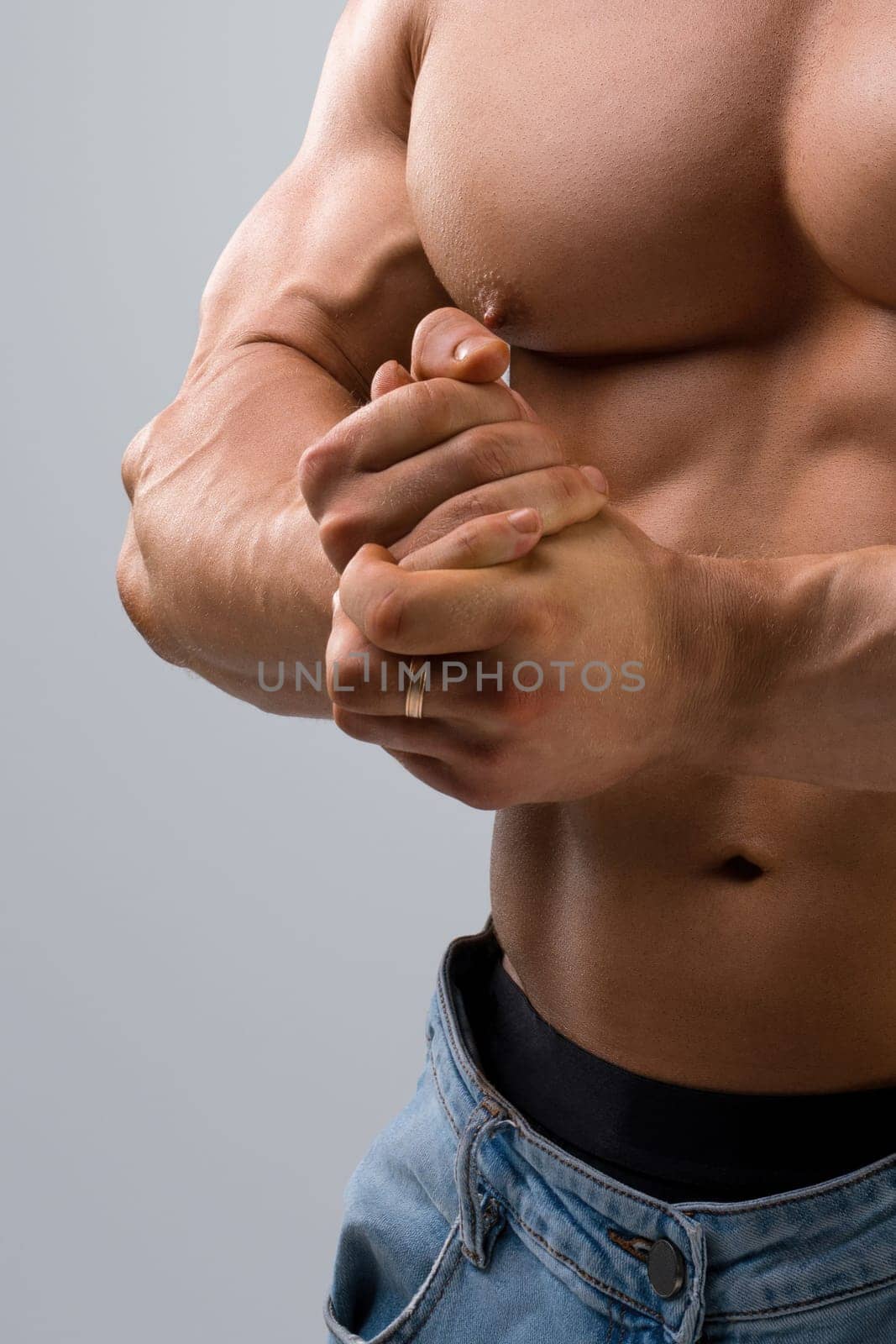 Handsome muscular bodybuilder cropped shot