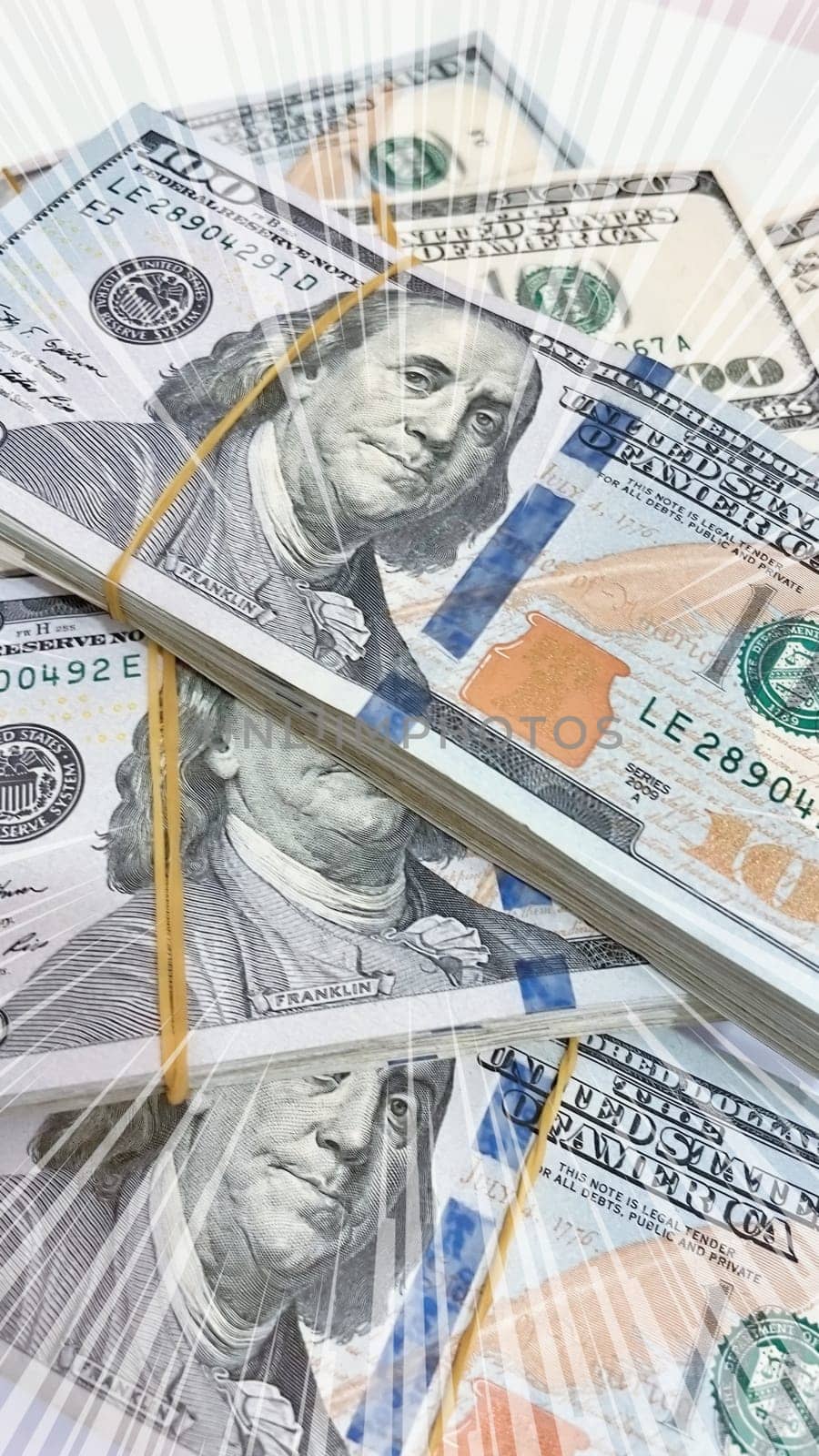A Fan of $100 Bills.A close-up photo of a fan of $100 US dollar bills. The bills are arranged neatly, with the portrait of Benjamin Franklin visible on each bill. The background is white.Finance ve economy concept.