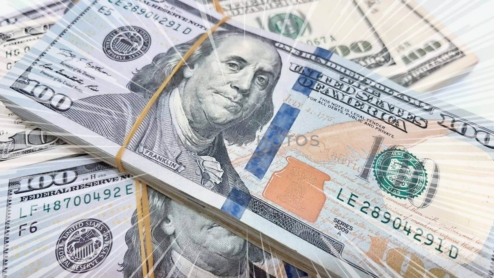 A Fan of $100 Bills.A close-up photo of a fan of $100 US dollar bills. The bills are arranged neatly, with the portrait of Benjamin Franklin visible on each bill. The background is white.Finance ve economy concept.