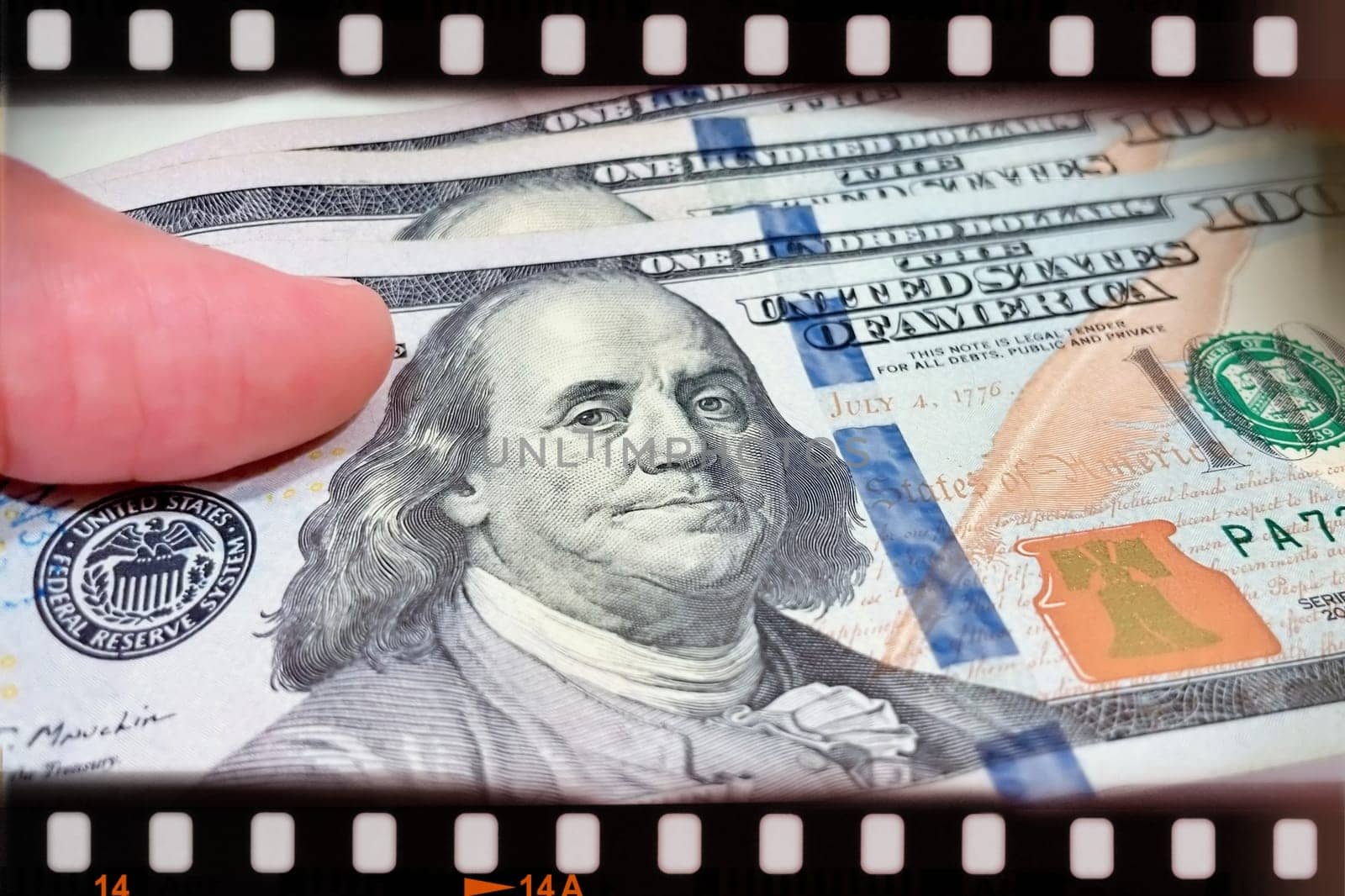 A Fan of $100 Bills.A close-up photo of a fan of $100 US dollar bills. The bills are arranged neatly, with the portrait of Benjamin Franklin visible on each bill. The background is white.Finance ve economy concept.