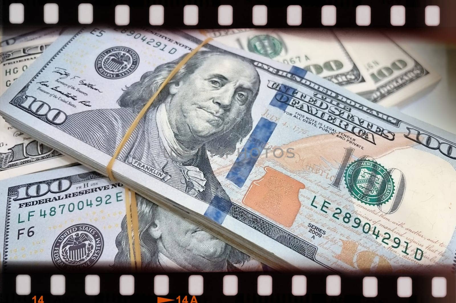 A Fan of $100 Bills.A close-up photo of a fan of $100 US dollar bills. The bills are arranged neatly, with the portrait of Benjamin Franklin visible on each bill. The background is white.Finance ve economy concept.