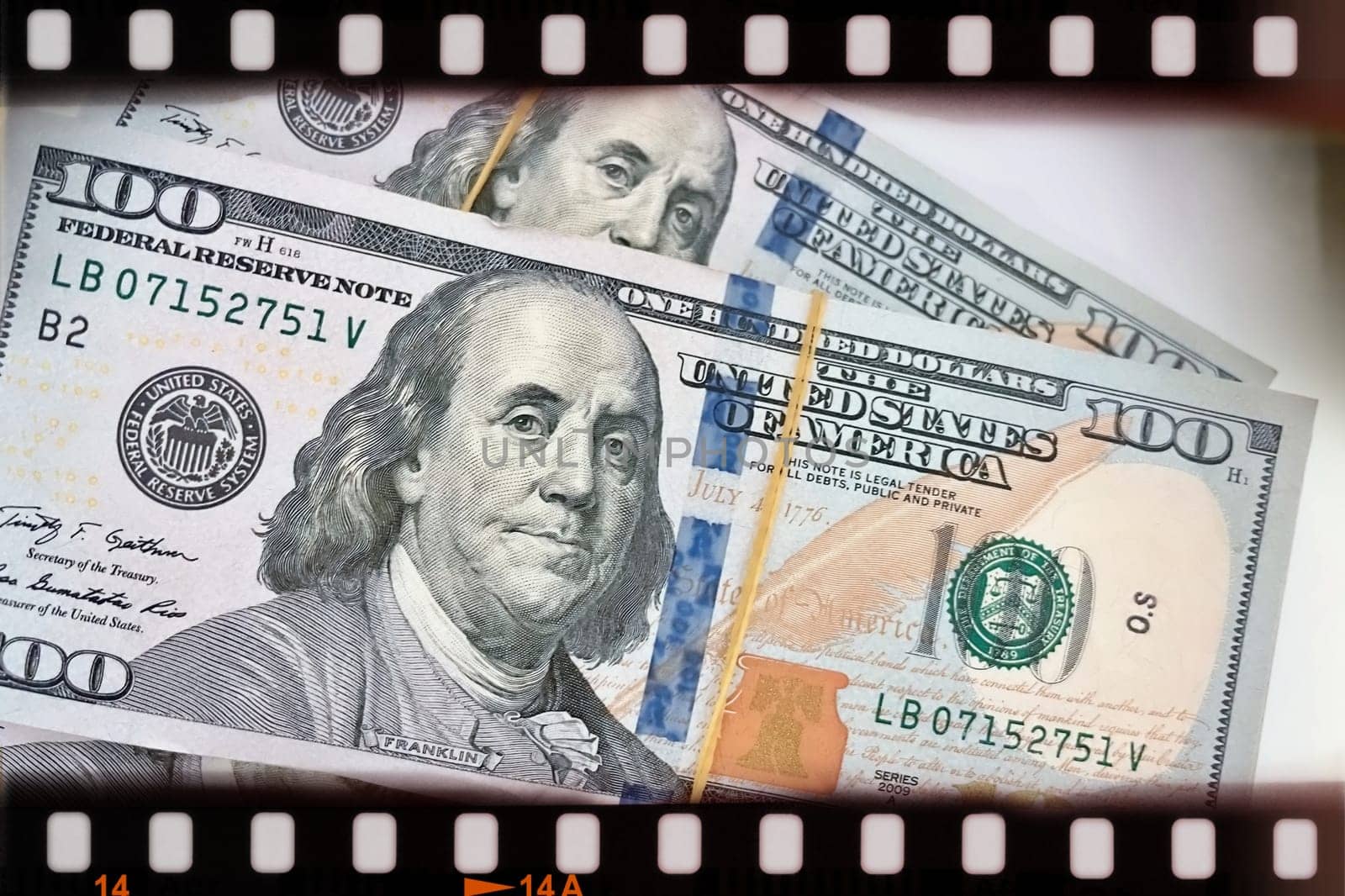 A Fan of $100 Bills.A close-up photo of a fan of $100 US dollar bills. The bills are arranged neatly, with the portrait of Benjamin Franklin visible on each bill. The background is white.Finance ve economy concept.