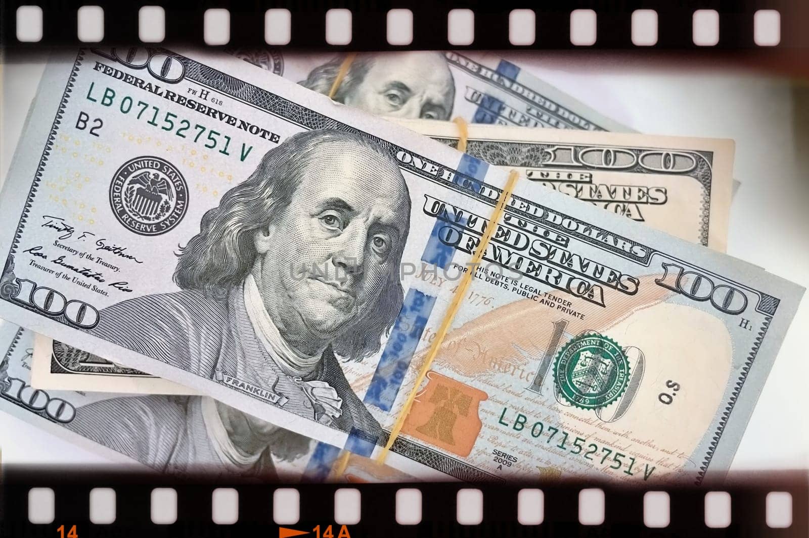A Fan of $100 Bills.A close-up photo of a fan of $100 US dollar bills. The bills are arranged neatly, with the portrait of Benjamin Franklin visible on each bill. The background is white.Finance ve economy concept.