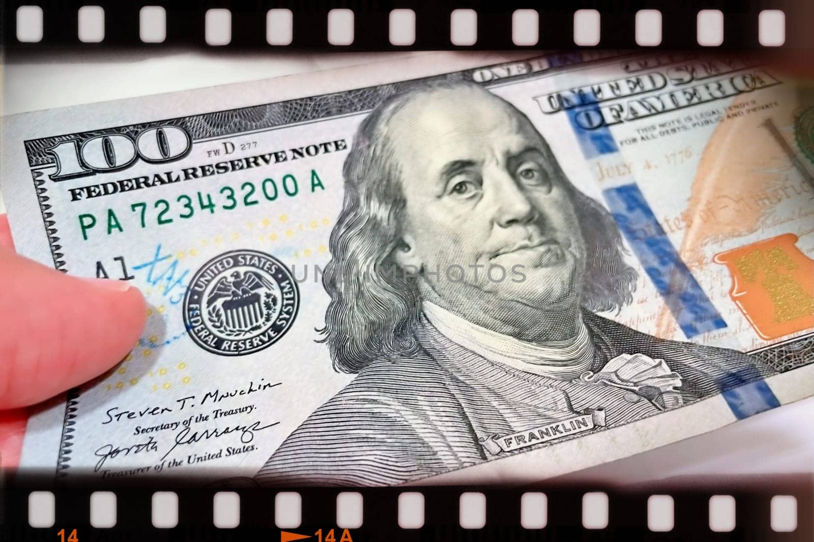 A Fan of $100 Bills.A close-up photo of a fan of $100 US dollar bills. The bills are arranged neatly, with the portrait of Benjamin Franklin visible on each bill. The background is white.Finance ve economy concept.
