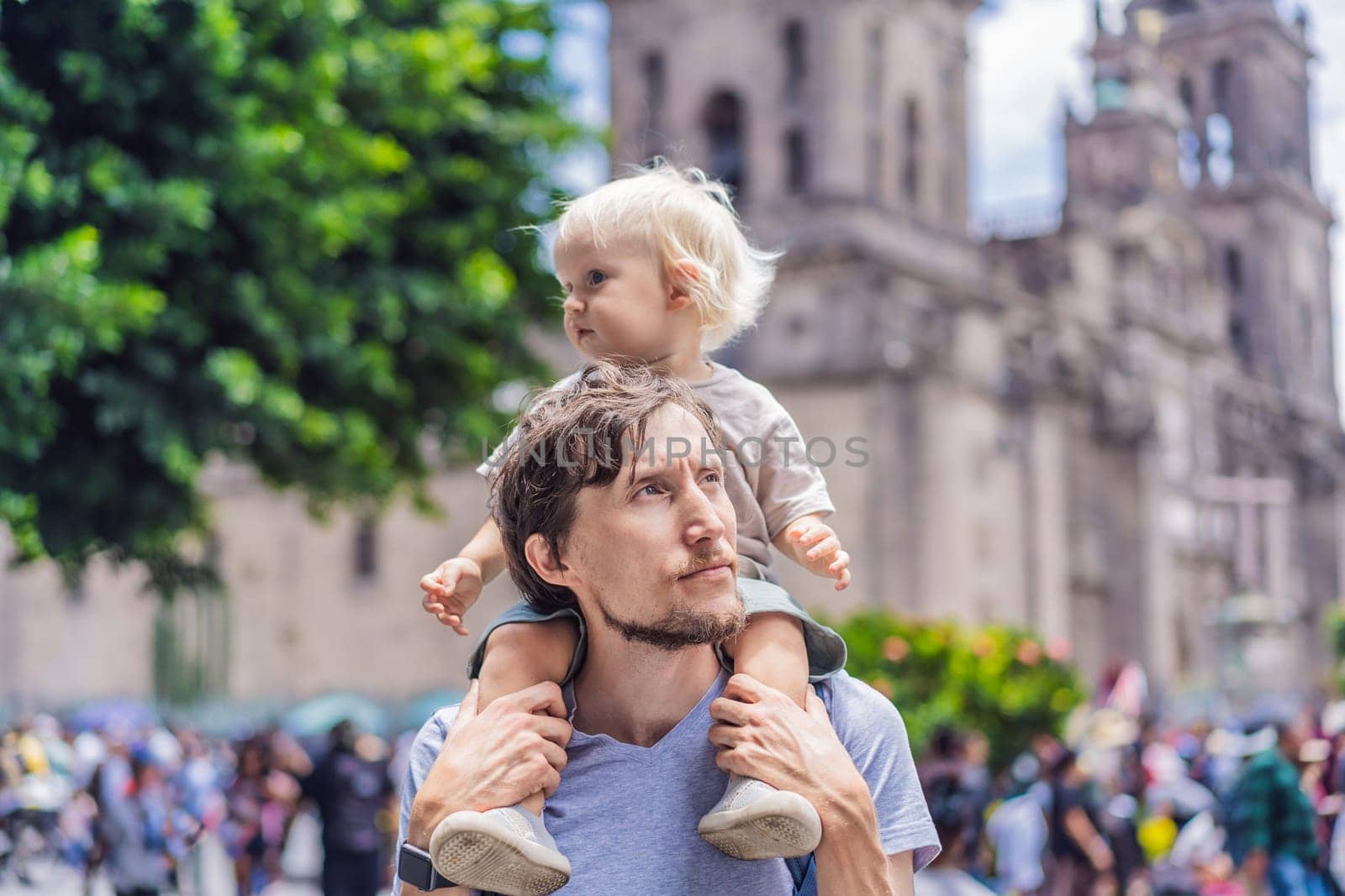 Father and son therists in front of Catedral Metropolitana de la Ciudad de Mexico. Cultural exploration, historic architecture, and travel experience concept.