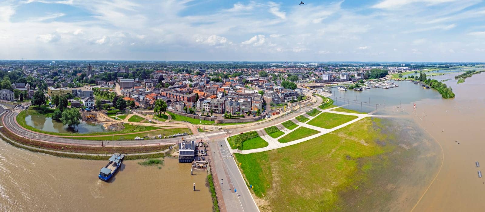 Aerial panorama from the town Tiel at the river Waal in a flooded landscape in the Netherlands
