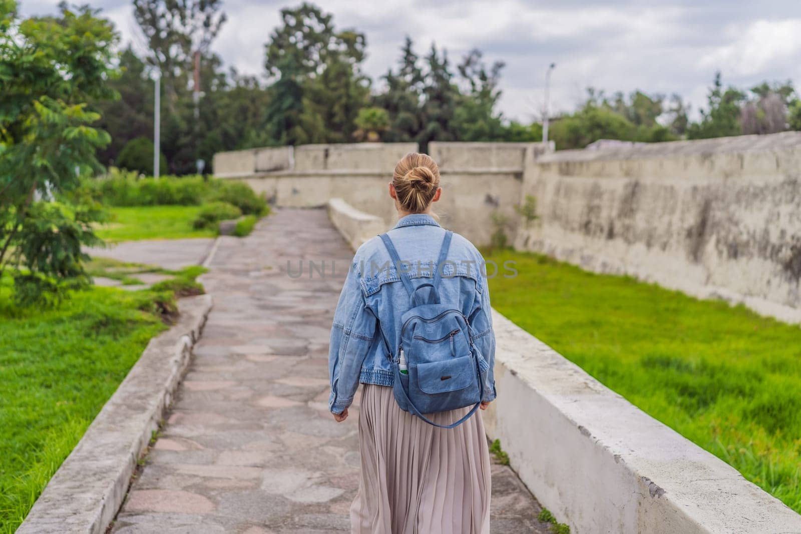 Female tourist exploring the Loreto Fort Museum in Puebla, Mexico. Cultural heritage, history, and travel exploration concept.