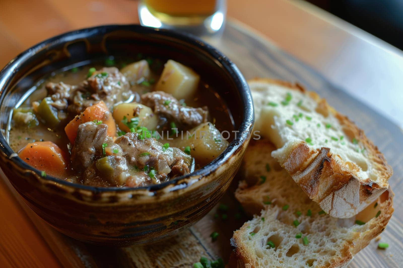 Steaming hot irish lamb stew, rich in flavor, served in a rustic bowl with hearty vegetables, paired with crusty soda bread on a wooden table. ideal for st. patrick's day gatherings, offering a cozy, traditional vibe.