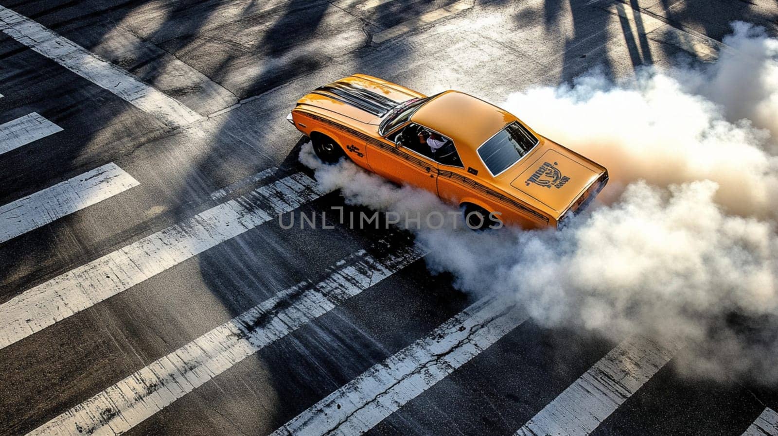 Classic yellow american muscle car is leaving a trail of smoke as it burns rubber while driving through an intersection