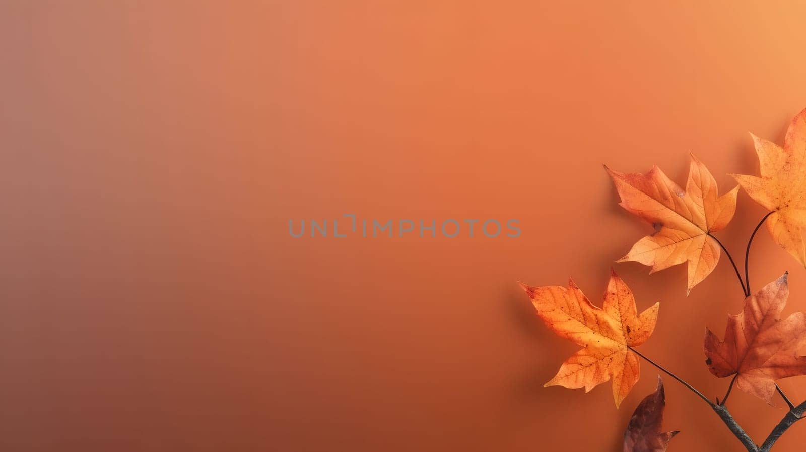 Close-up of vibrant autumn leaves on a warm, orange background, capturing the beauty of the fall season.