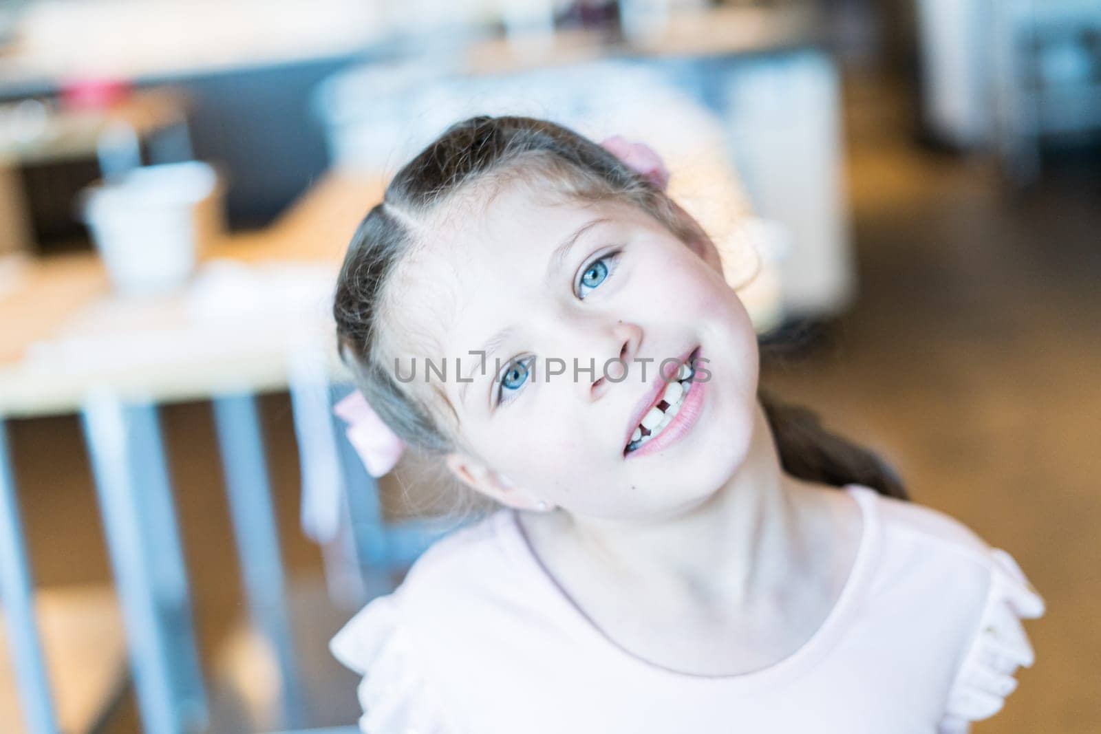 School age girl smiling for the camera.