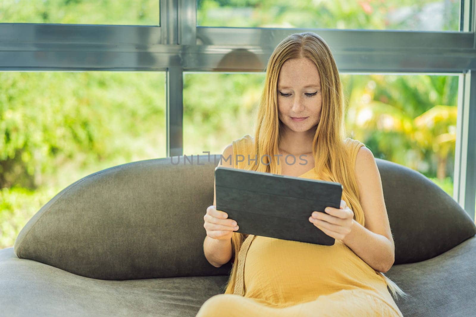 Mobile pregnancy online maternity application. Pregnant mother using phone. Pregnancy, medicine, pharmaceutics, health care and people concept by galitskaya