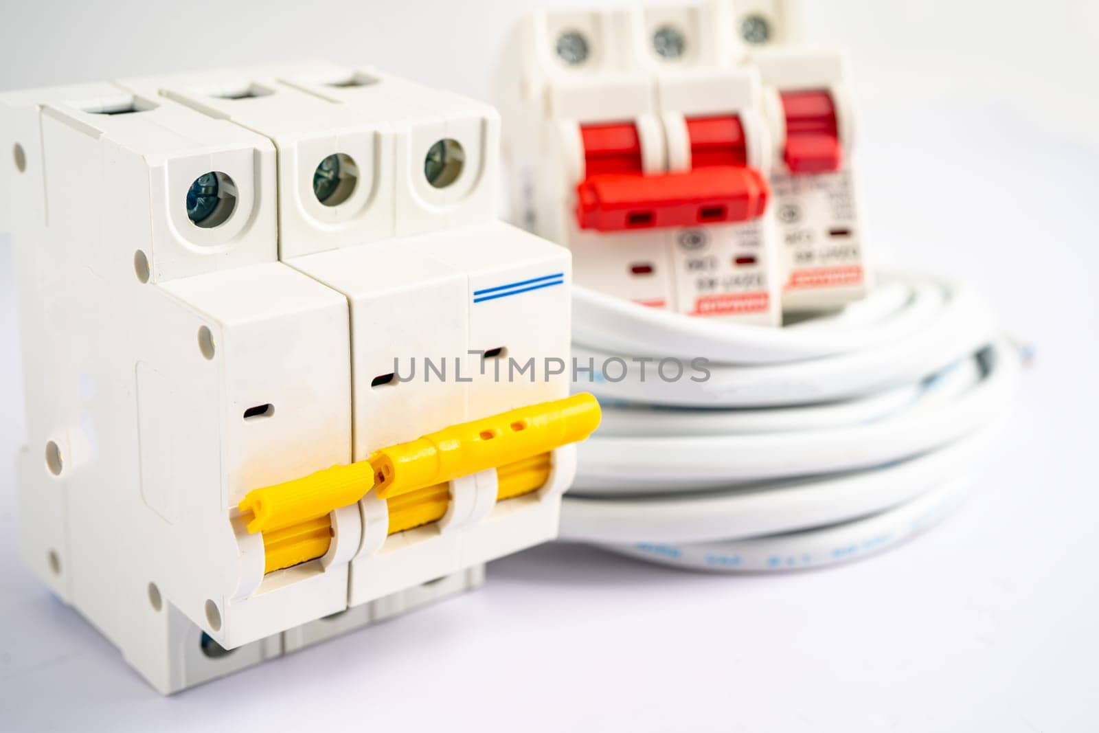 Automatic circuit breaker on white background, control and protect electrical power system. by pamai