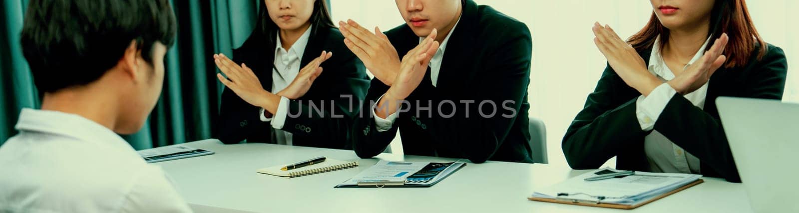 Candidate is rejected by job interviewer and human resources manager showing concept of unemployment, fired, disagreement and turning down the offer putting sadness on hiring person. Oratory failure.